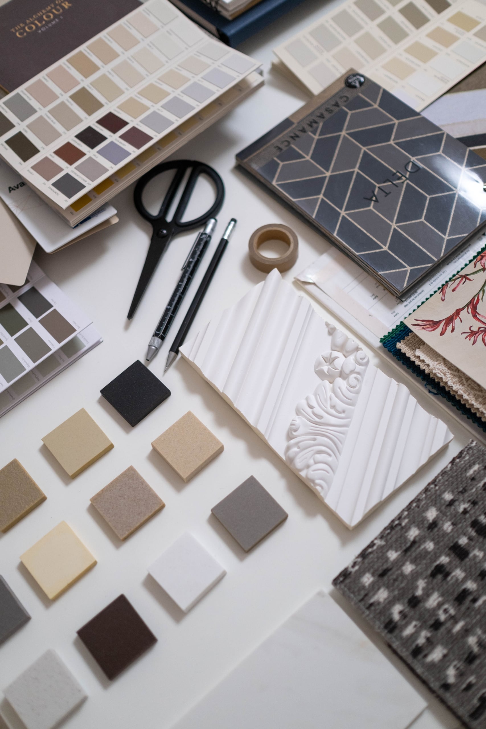 Material samples, colour swatches and finish boards laid out during design