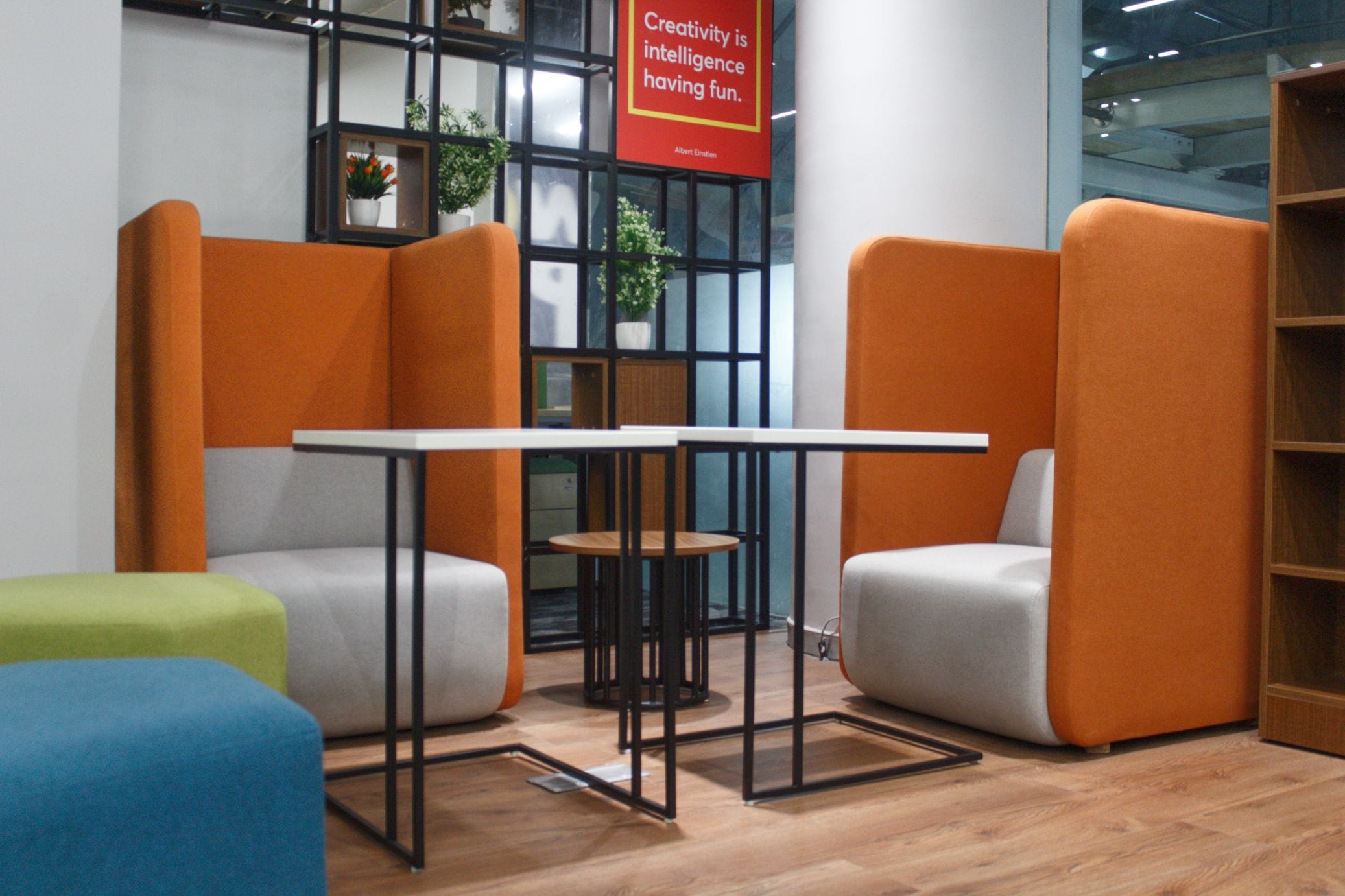 Breakout area with orange lounge chairs at Flock office