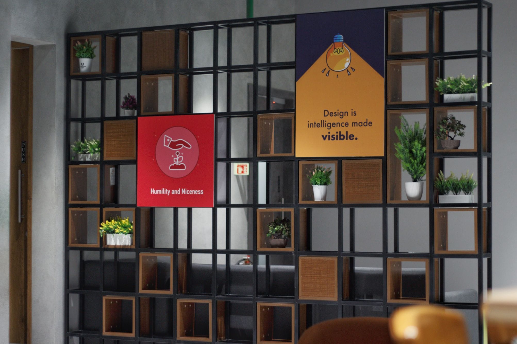 Library partition with typographic quotes at Flock office