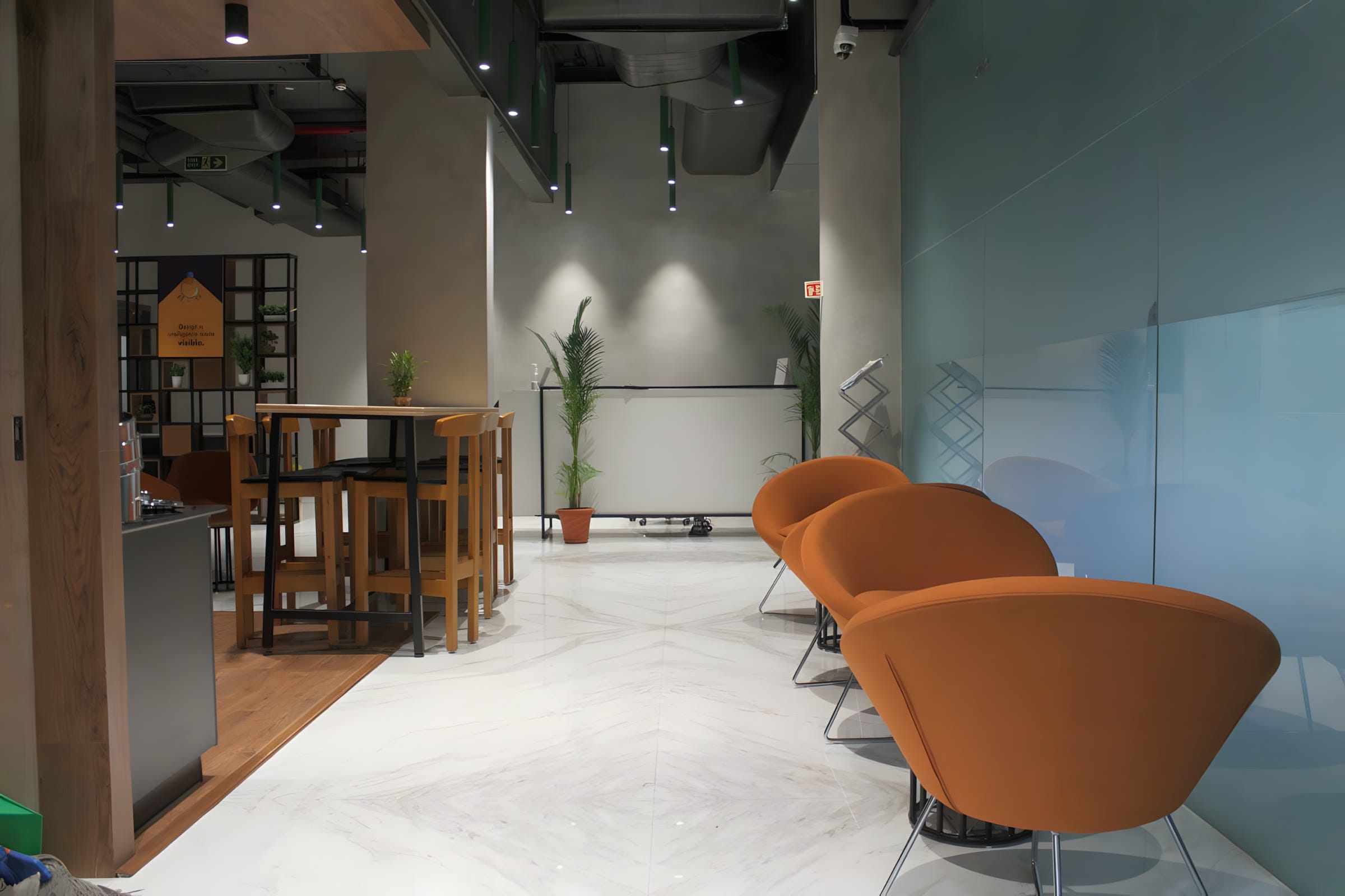 Reception and entrance lobby with orange accents at Flock office