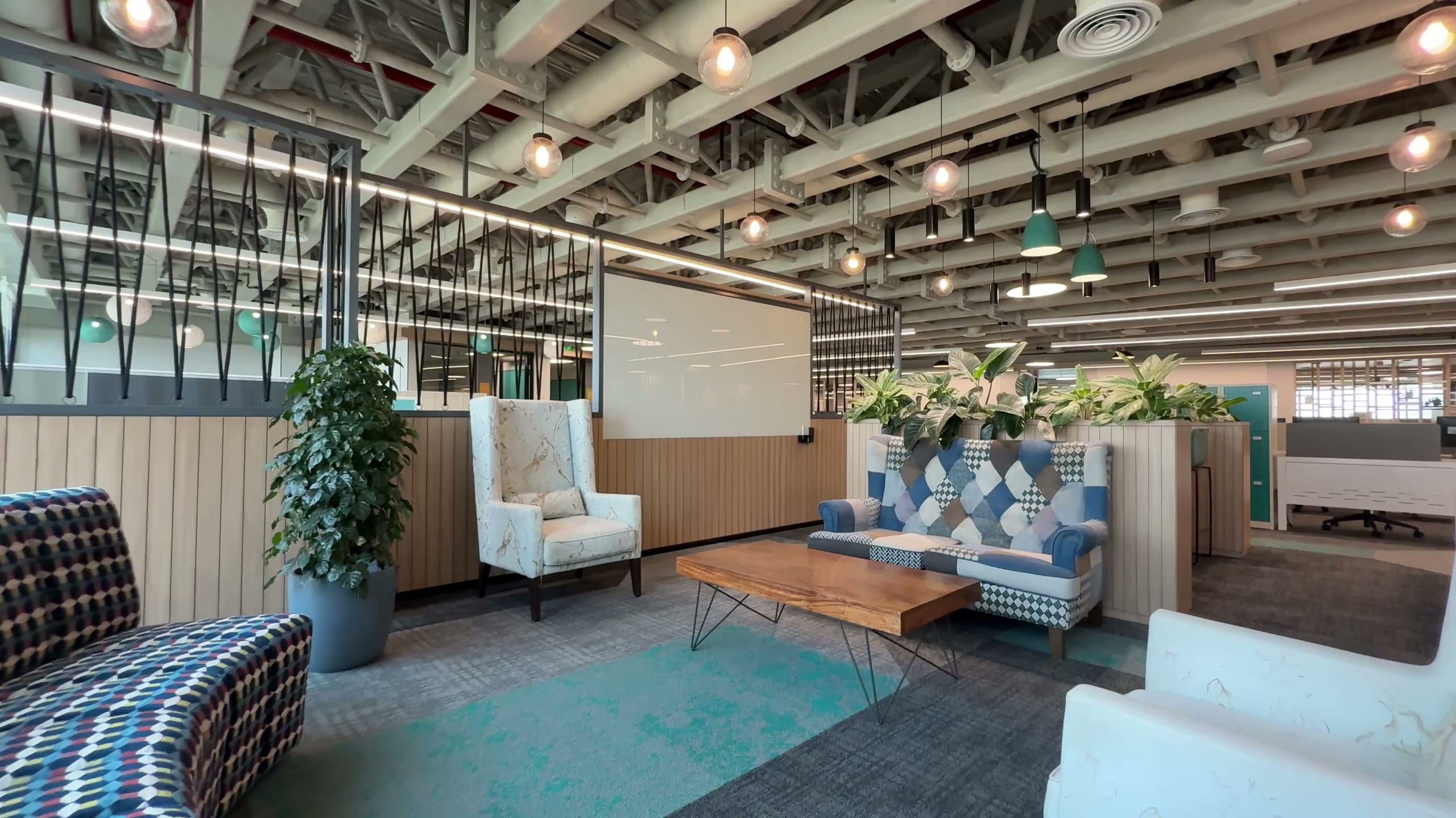 Designer sofas in the HPE office breakout area