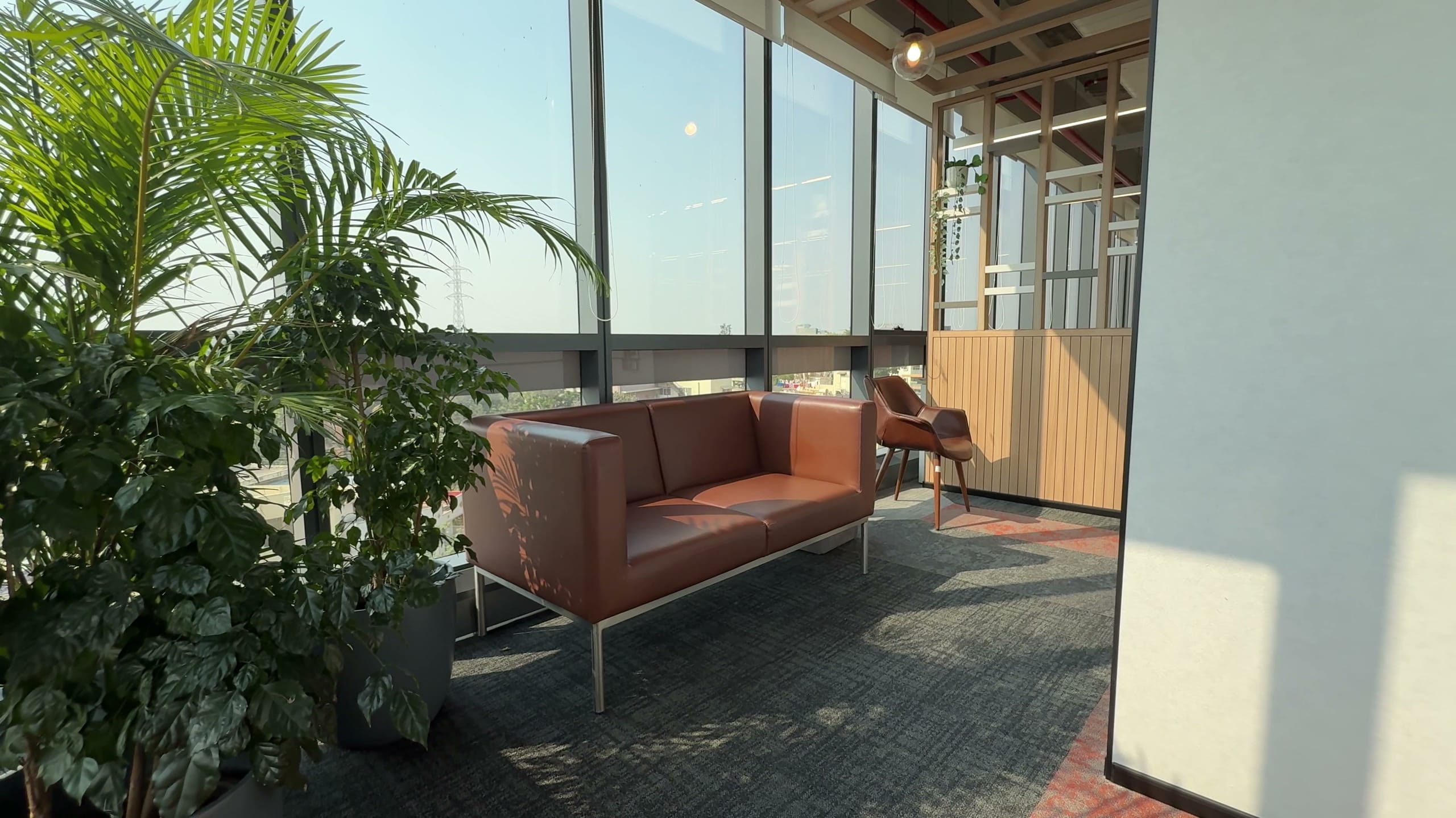 Breakout area with leather sofa by the window, HPE office