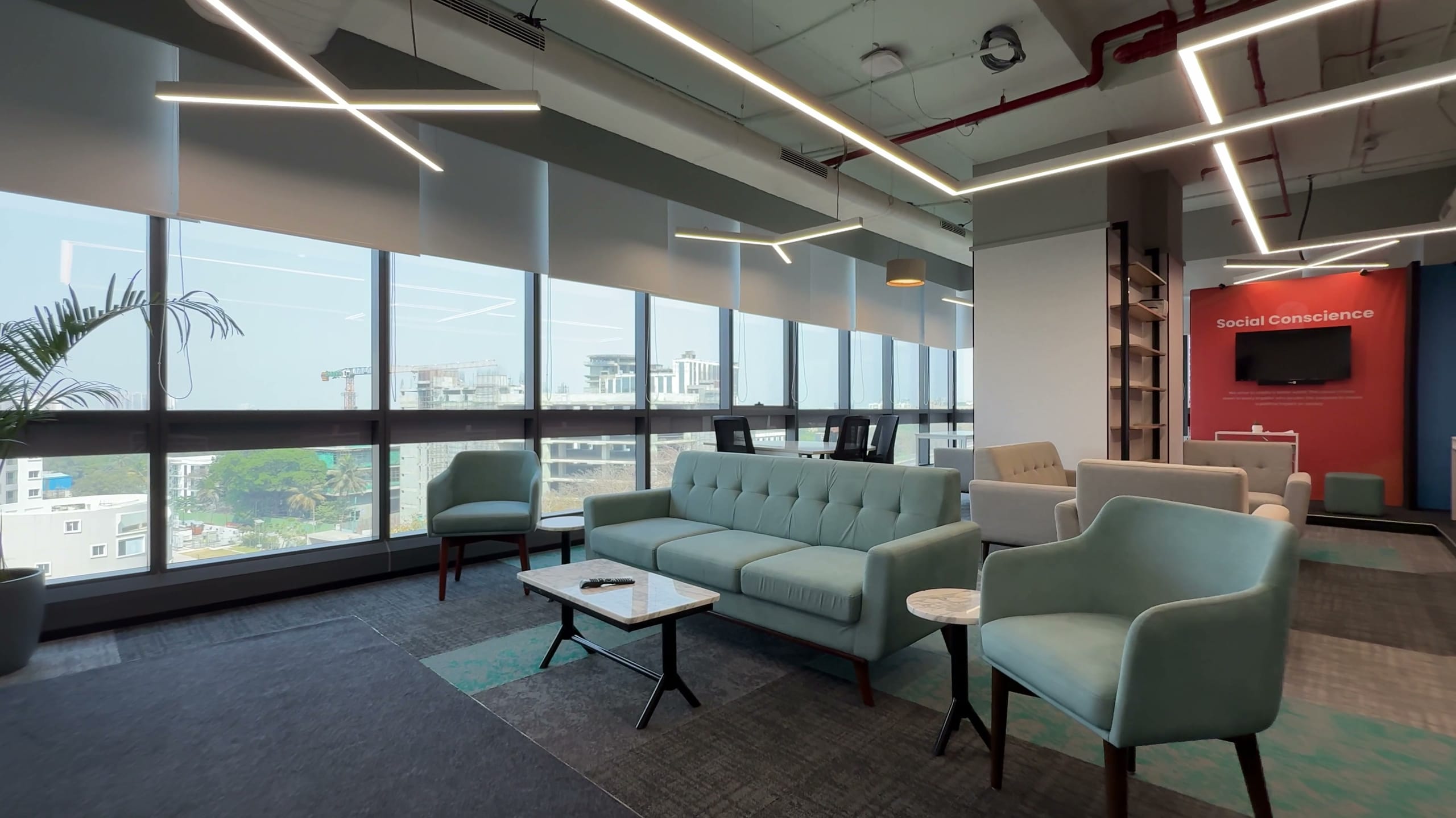 Breakout lounge with sky-blue sofas at HPE office