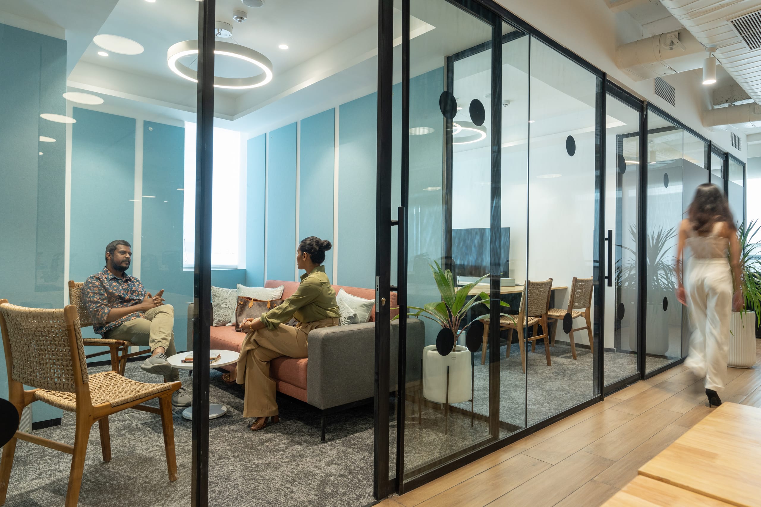 Glass-partitioned meeting rooms at MOSS office