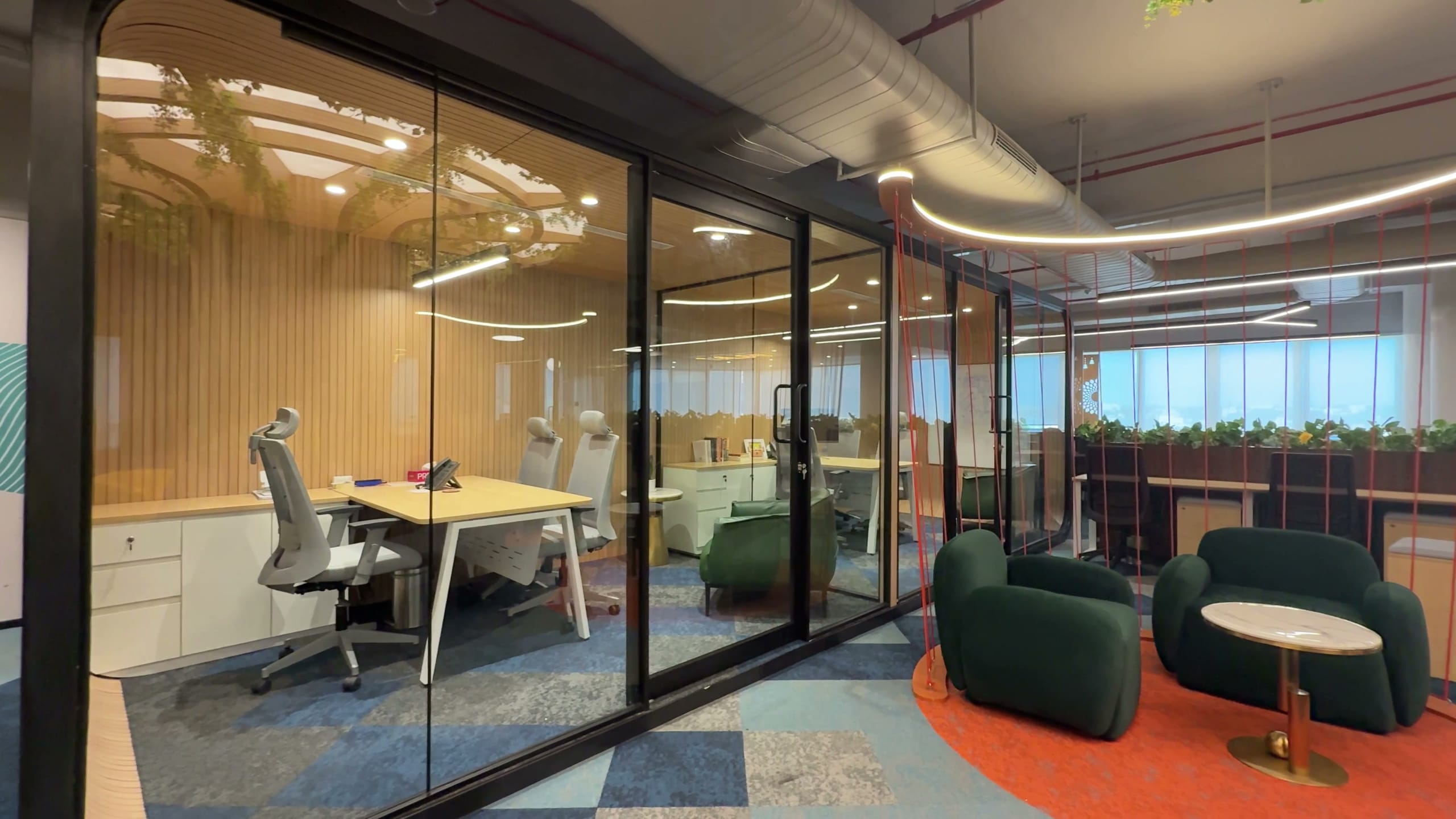 Glass-fronted cabin viewed from the Rugr office workspace