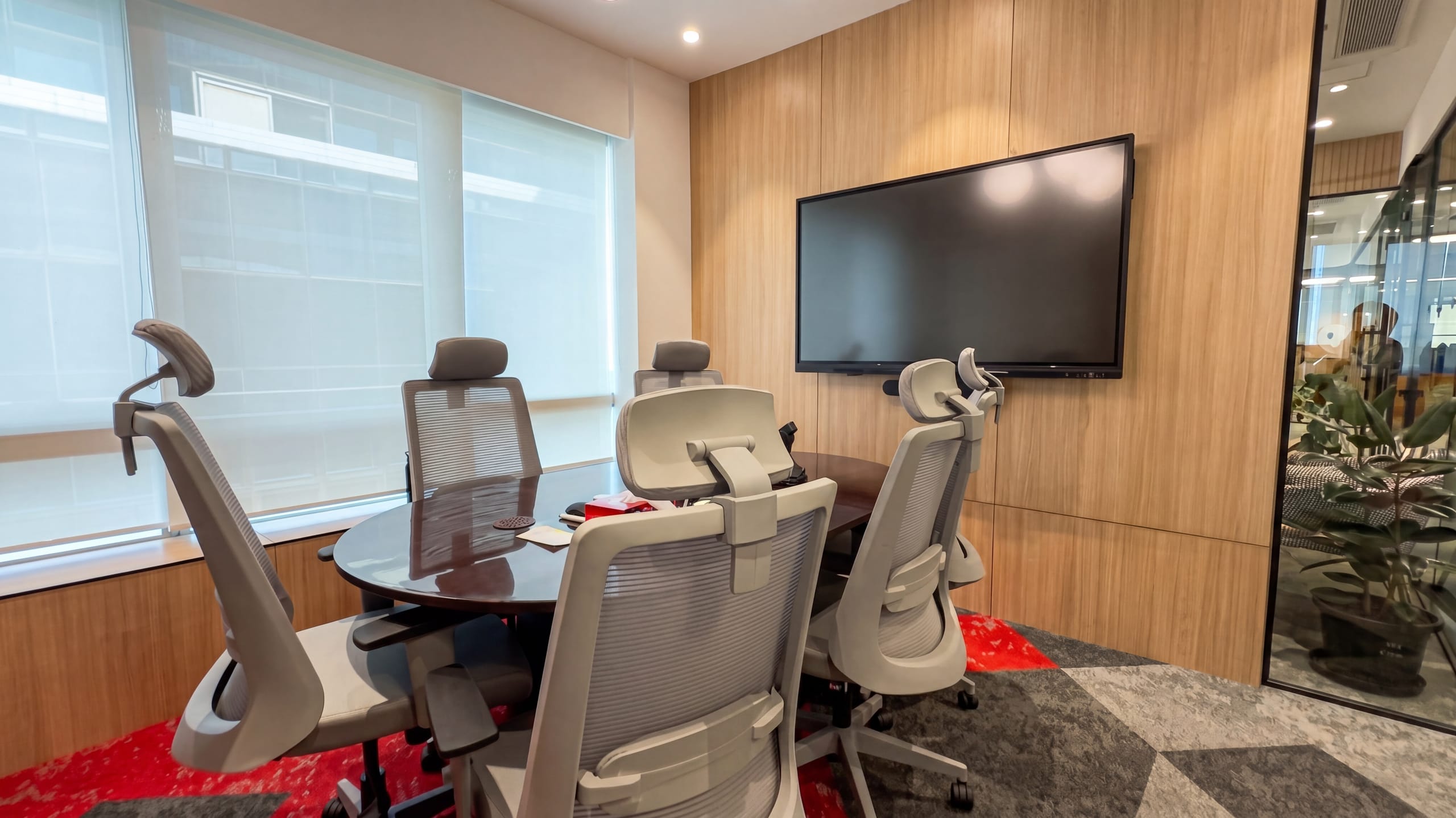 Meeting room with grey upholstered chairs, Rugr office
