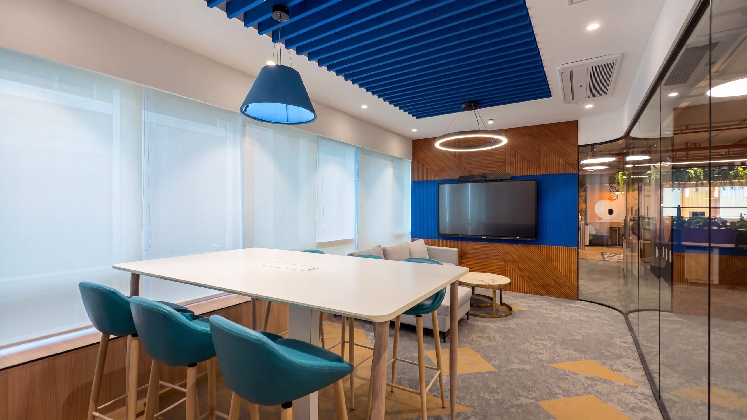 Glass-walled meeting room with presentation screen, Rugr office
