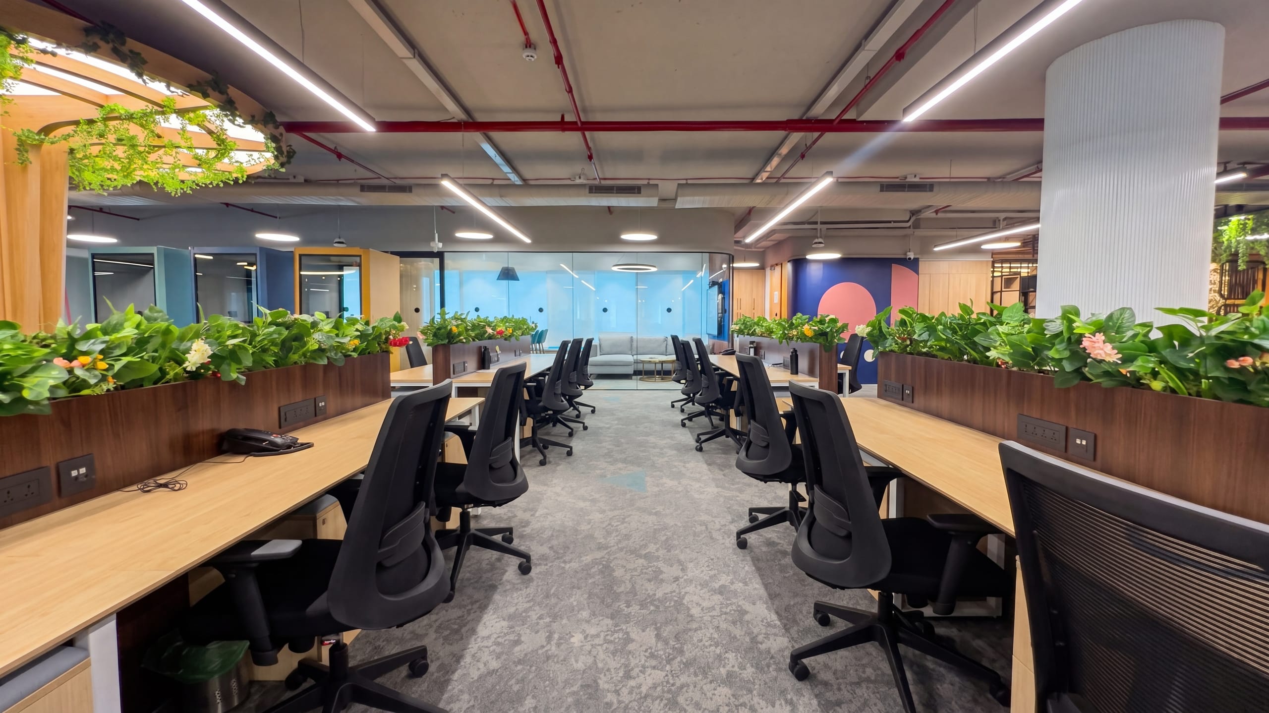 Open-plan workstations along the passage at Rugr office