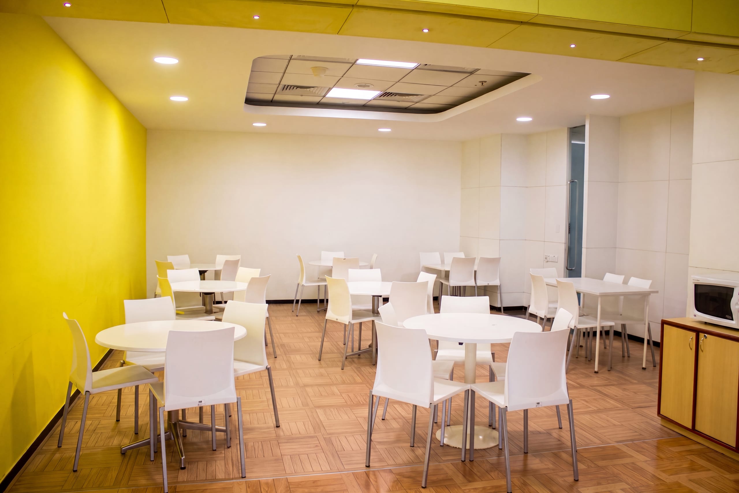 Bright yellow office cafeteria at Temenos office