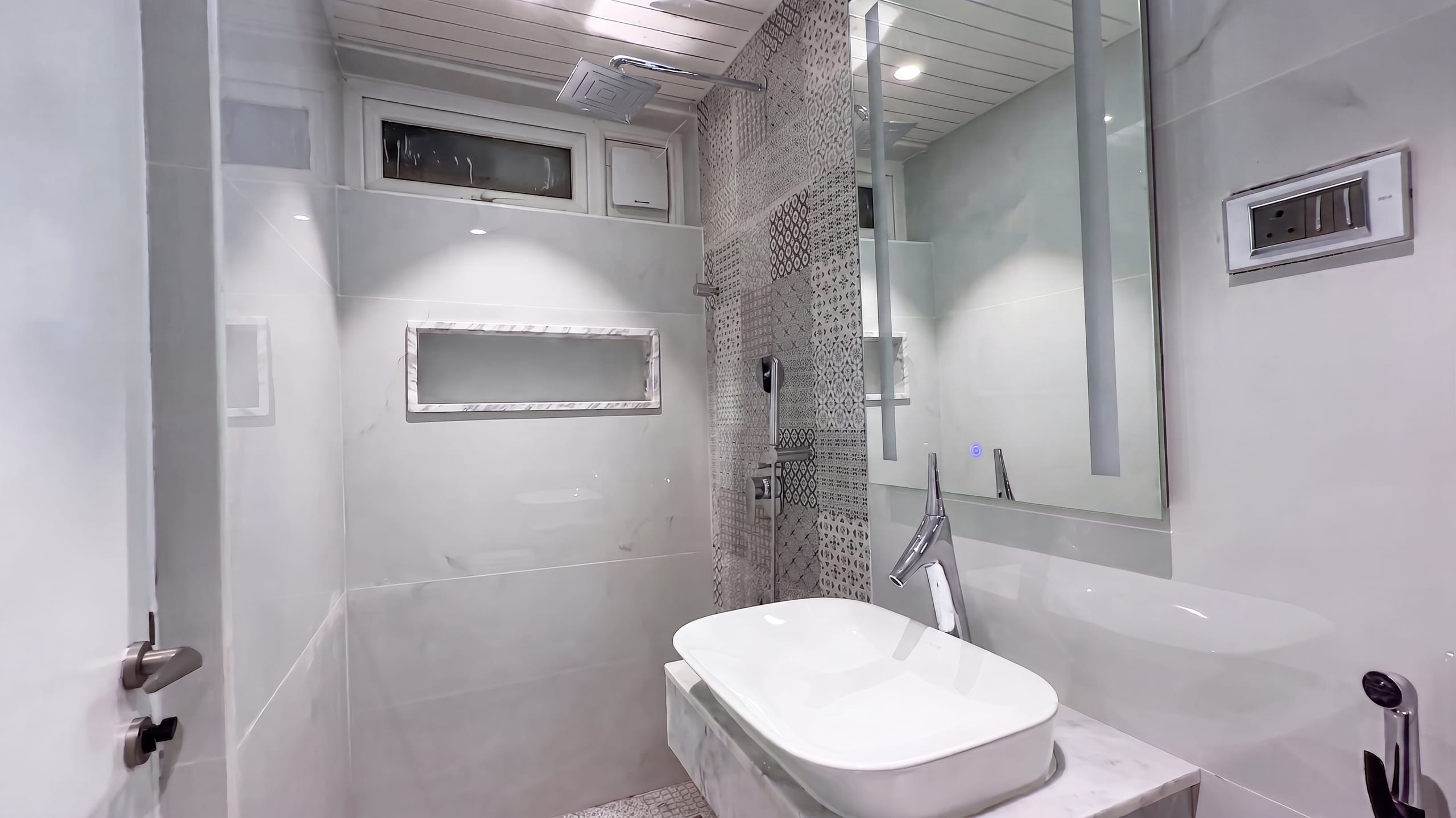 Second bathroom with shower and vanity at the Diamond District penthouse