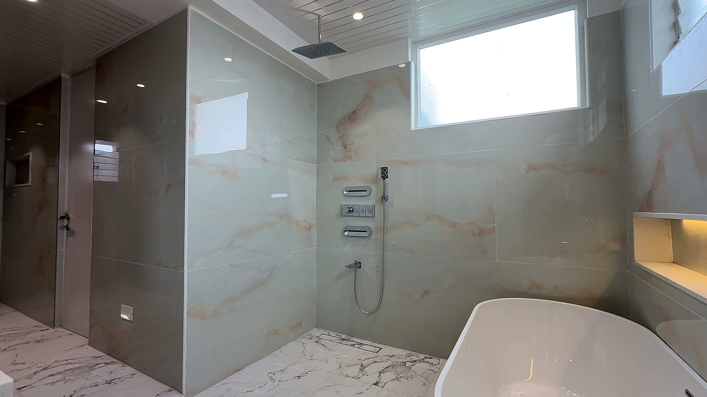 Master bathroom shower at the Diamond District penthouse