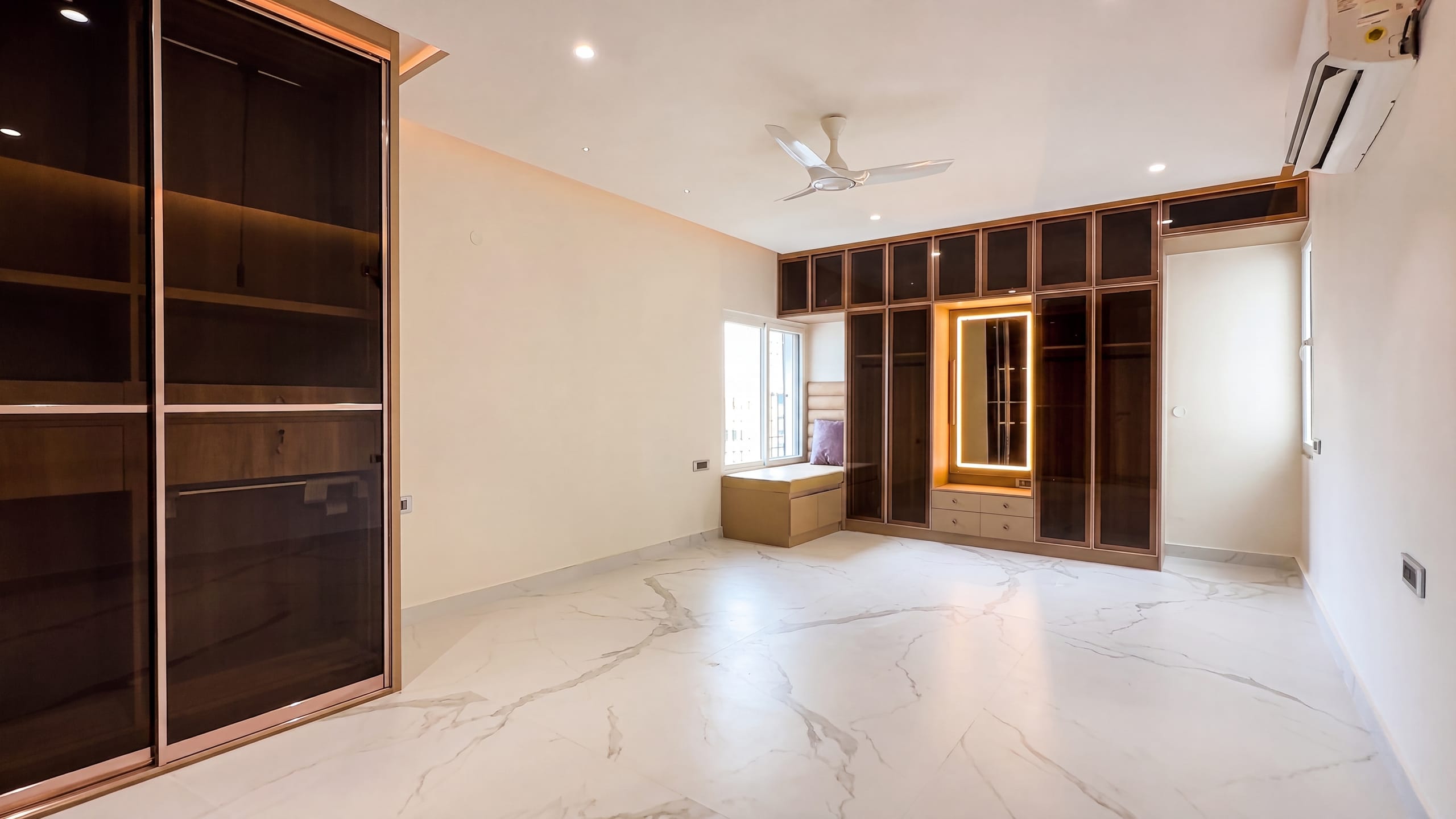 Fourth bedroom with wardrobe and lit dressing table at the Diamond District penthouse