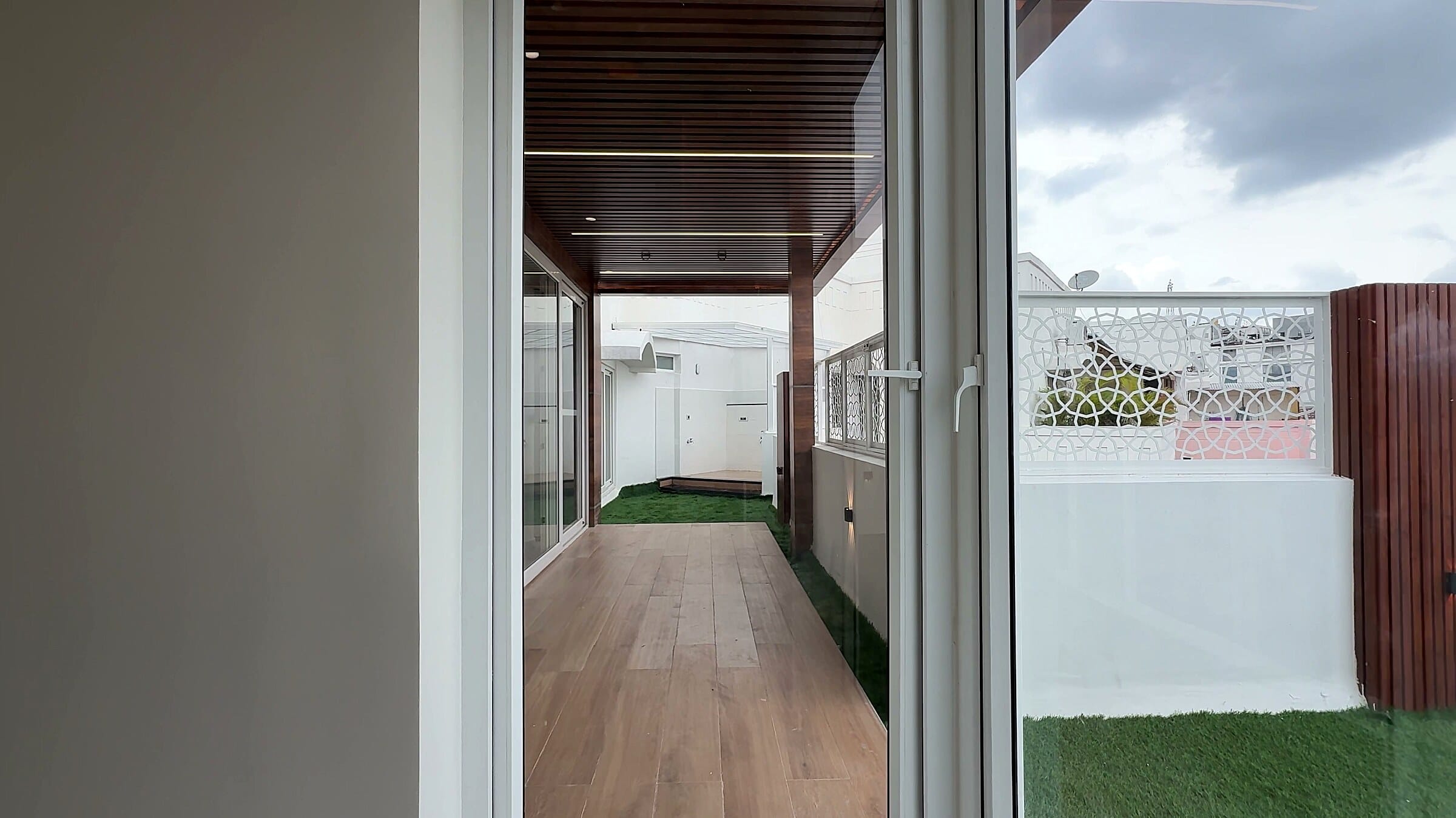 Outdoor balcony passage seen from the master bedroom at the Diamond District penthouse