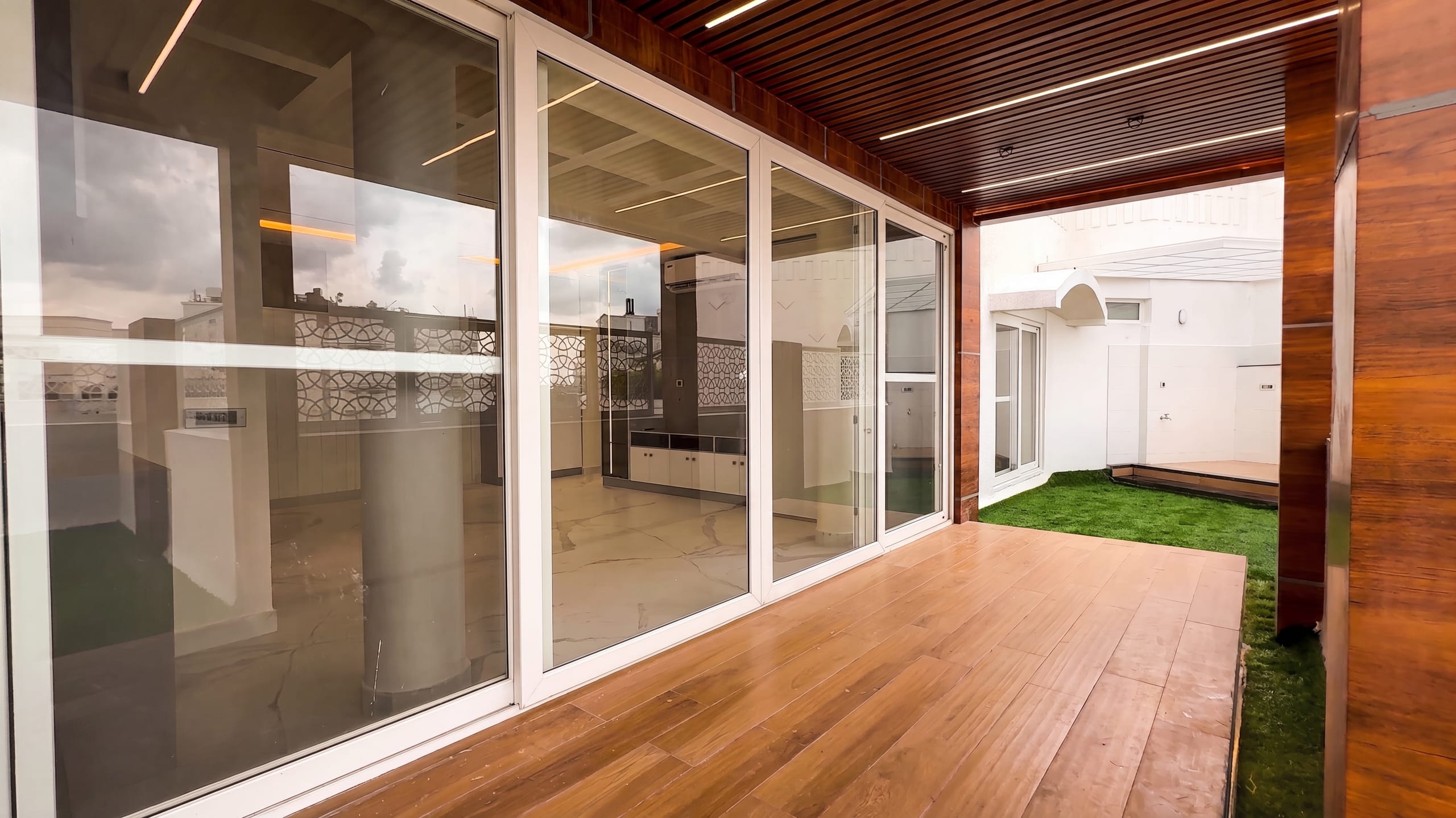 Outdoor balcony with timber decking connecting to the hall at the Diamond District penthouse