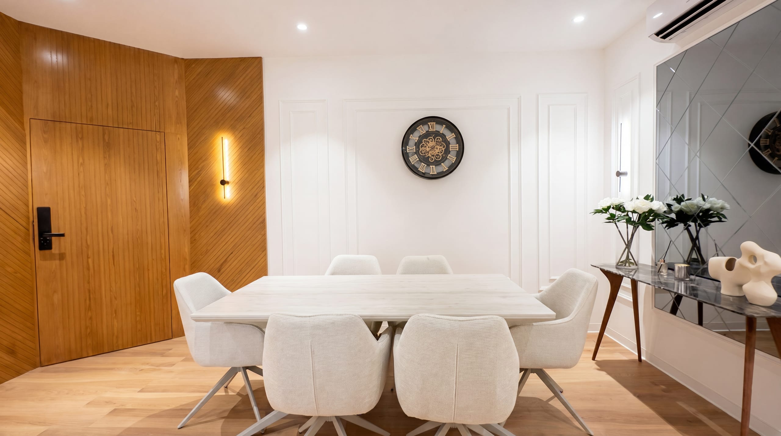 Dining hall with feature wall clock at the Golden Enclave flat