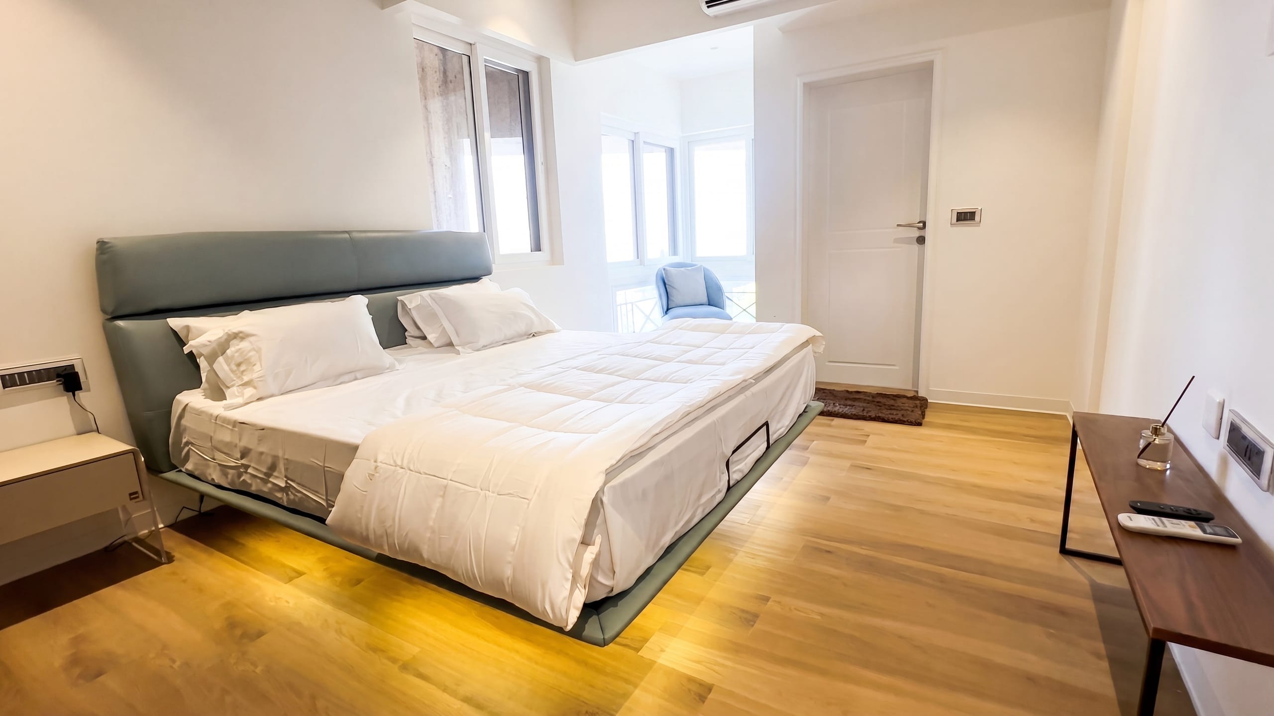Master bedroom with floating bed at the Golden Enclave flat